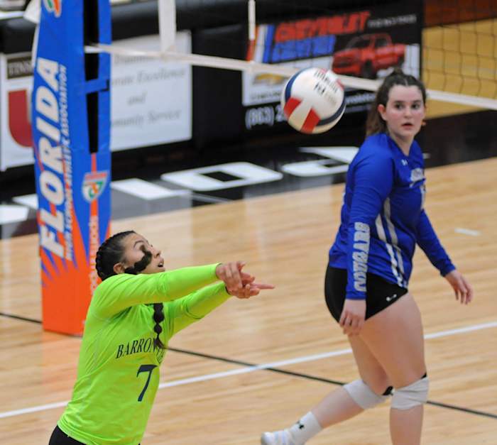Barron Collier libero Ashley Giraldo goes for one of her 17 digs against Jensen Beach.